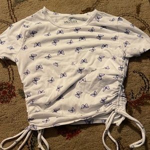 A white top with butterflies